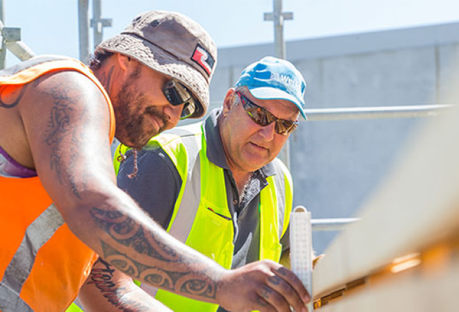 An instructor providing guidance to a trainee.