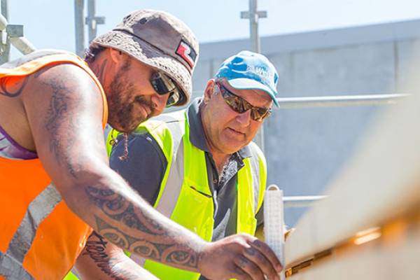 An instructor providing guidance to a trainee.