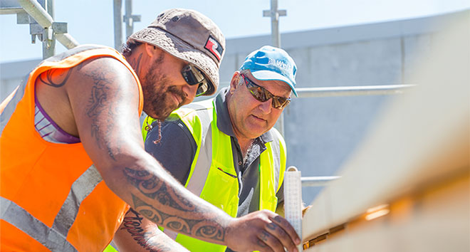 An instructor providing guidance to a trainee.