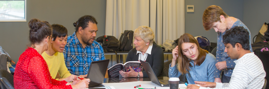 A group of educators engaged in a discussion.