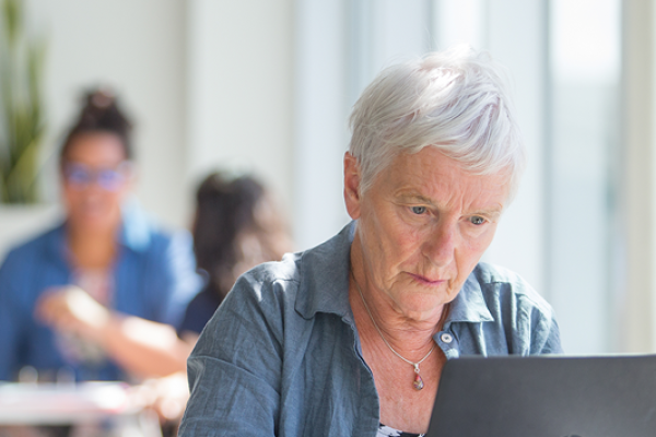 An educator using a laptop.