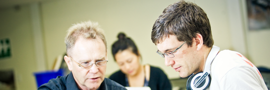 Educator engaging in a conversation with his learner.