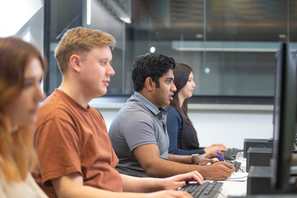 Learners engaging in computer-based learning.