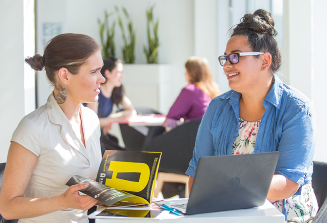 two learners discussing AI software